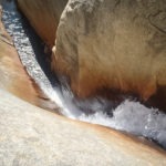 Inside the waterfall. No more red helmet.