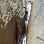 Dave rappelling the first rappel of Shaver Cut.
