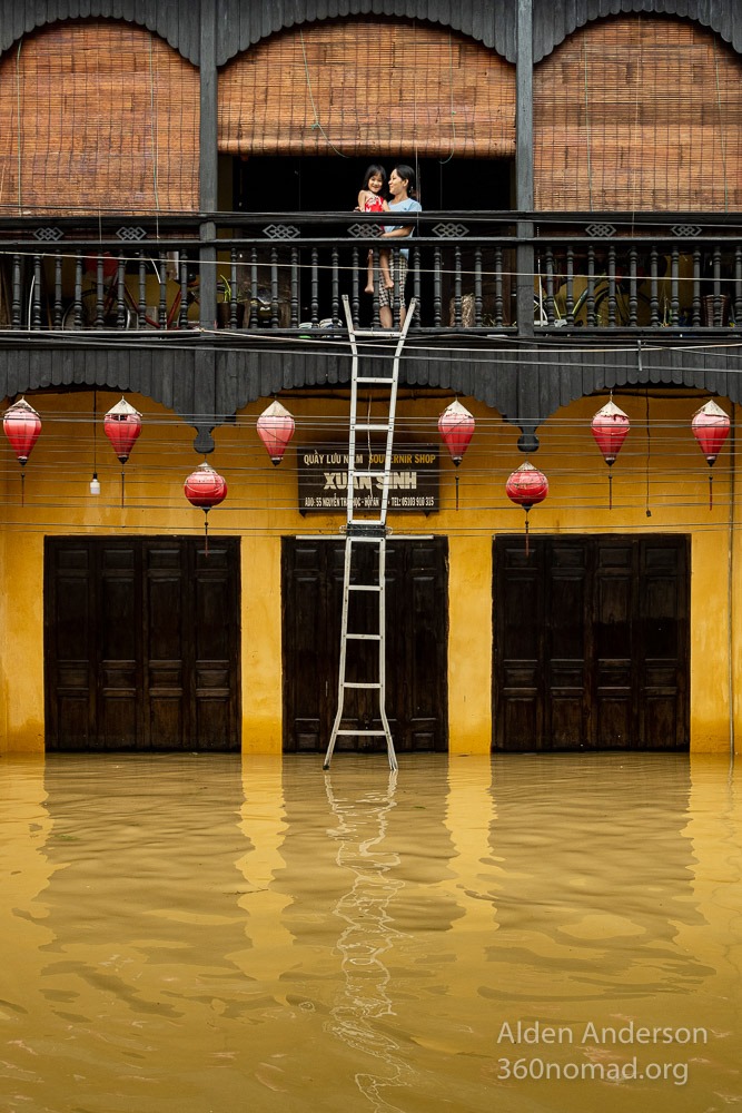 Nga with her daughter during the flood in Hoi An Vietnam